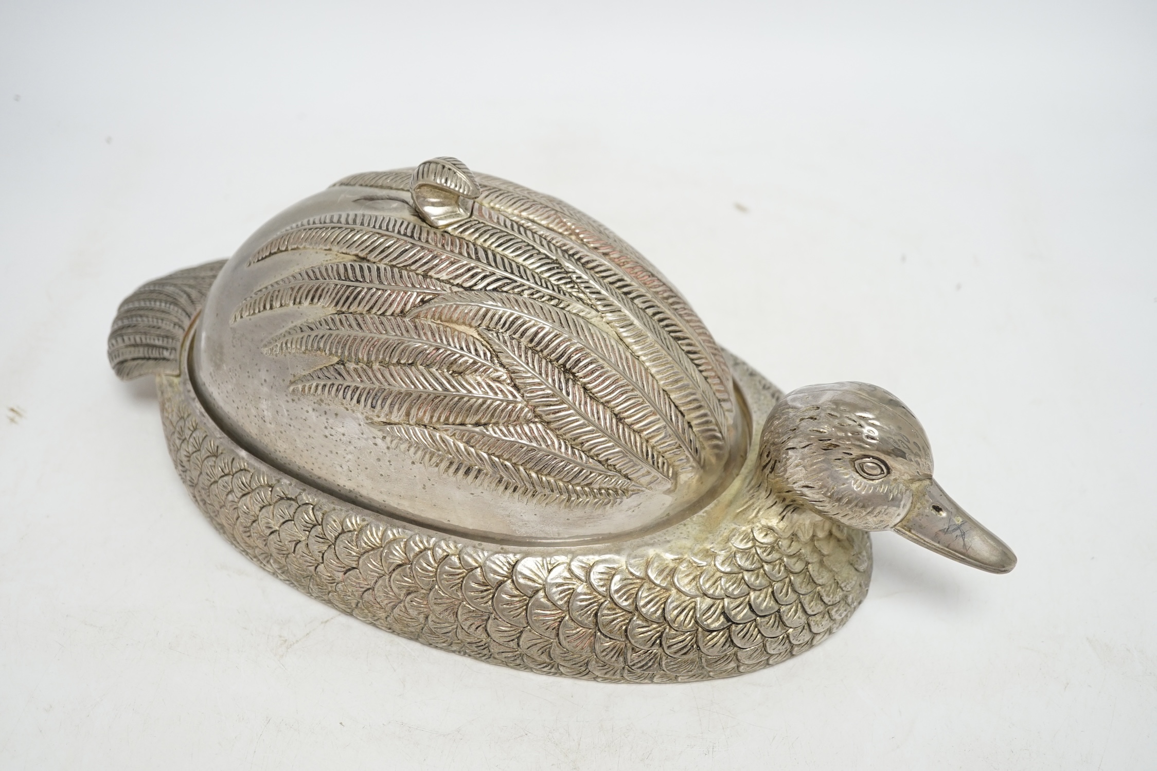 A novelty silver plated dish and cover, in the form of a duck, 37cm long. Condition - good